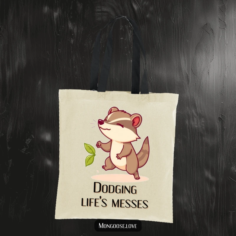 Funny Mongoose Tote Bag: A stylish bag showing a mongoose dodging a leaf with flair, a chic funny gift.